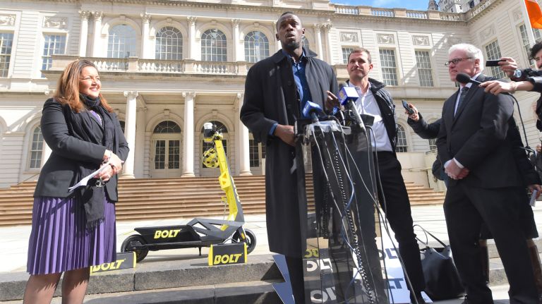 Olympian Usain Bolt advocates for e-scooters at City Hall 2 Olympic gold medalist Usain Bolt, center, touted Bolt Mobility -- an environmentally-friendly e-scooter -- outside City Hall in lower Manhattan on Tuesday.