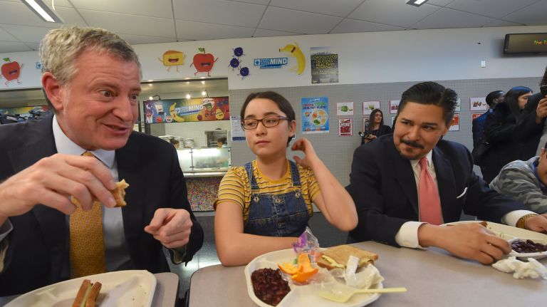 Mayor Bill de Blasio, left, and NYC Department of Education Chancellor Richard Carranza sample new food options at Brooklyn's P.S. 130 on Monday.