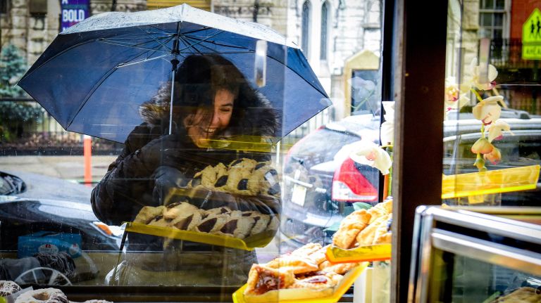 Moishe's Kosher Bake Shop closes after decades in East Village 2 Hamantashen for Purim are reflected in the store window last year.