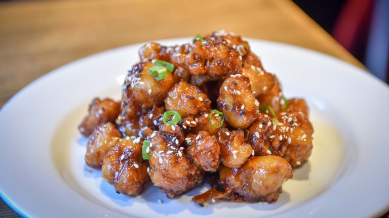 NYC firefighter behind the menu at new Kips Bay restaurant Home Base 1 The General Tso's cauliflower at Home base.