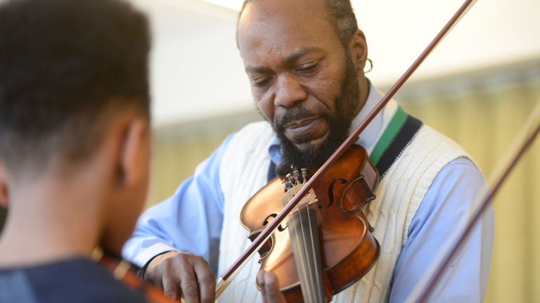 East New York kids gain confidence and opportunity with free violin lessons 3 Over 20 years ago, Sygapolho trained under a professional violinist so he could learn to teach his students how to play the classical instrument.