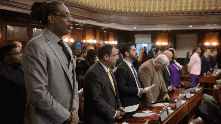 City Council Member Robert Cornegy, Jr.&nbsp;towers over other council members as he sings "Lift Every Voice and Sing" on Oct. 27, 2016.