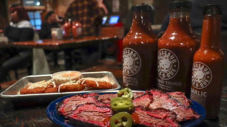 How to fix your country food cravings in NYC 5 Dinosaur Bar-B-Que, which has locations in Harlem and Brooklyn, offers a collection of homemade barbecue sauces and slow-smoked meats, including brisket that is smothered in sauce and topped off with sliced jalapeno peppers.