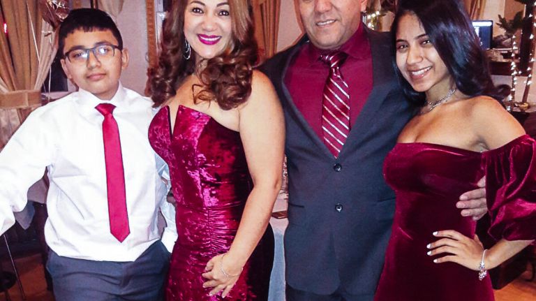 Cobos, center-right, is pictured recently with his wife, Karina, and two children.
