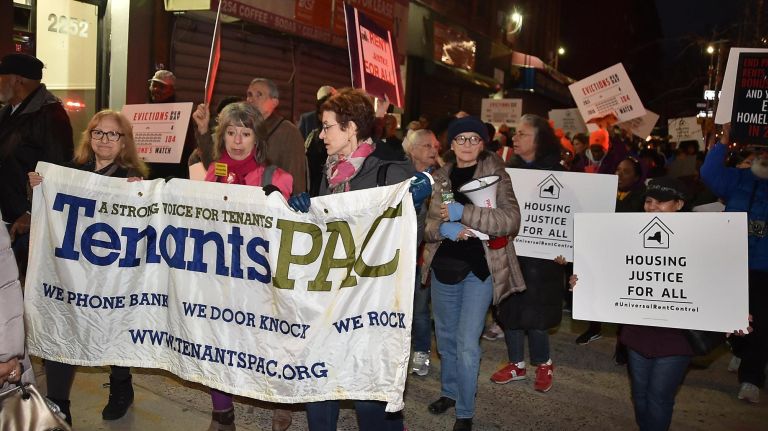 Protesters march in Harlem for a housing justice rally on April 11.