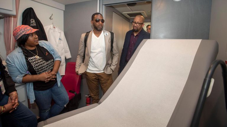 Public Advocate Jumaane Williams, second from right, was among visitors touring the new mobile health center, which expands service to Queens and Staten Island.