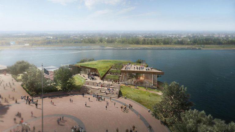 The Statue of Liberty Museum holds original torch, 'soaring' theater space 3 The new building, designed by FXCollaborative, with experience and exhibit design by ESI Design, will allow for expanded access to artifacts, content and exhibits on the history of the Statue of Liberty, its original concept, design, construction and 1986 centennial restoration.