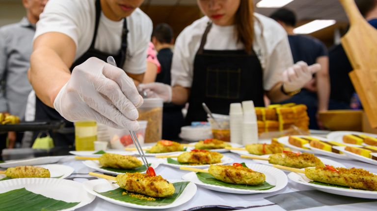 Warung Jancook serves chicken satay lilit at the Queens International Night Market's vendor preview on April 8.