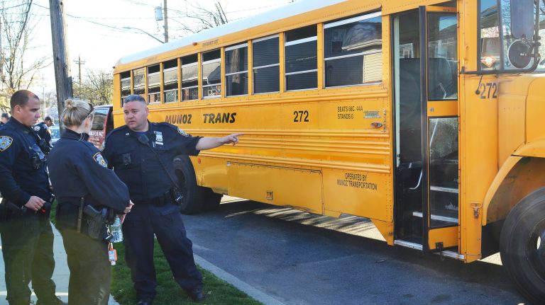 A 7-year-old boy died in Far Rockaway, Queens on Wednesday after he became pinned between a van and a school bus, police said.