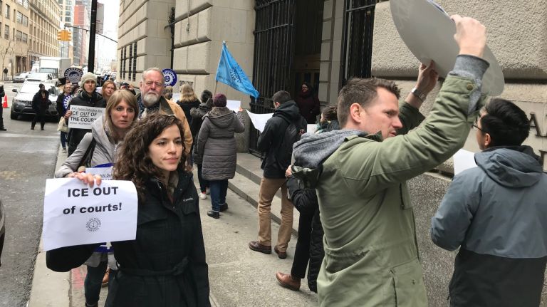 Legal Aid Society attorneys protest against ICE agents who make arrests inside courthouses outside of U.S. District Court in Brooklyn on April 6, 2018.
