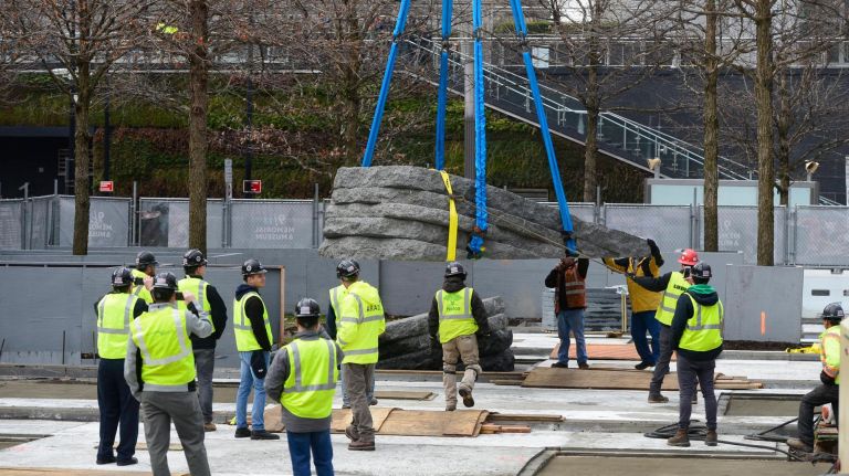 A new memorial is installed at National September 11 Memorial & Museum plaza 3 The giant stones will eventually face upward from the ground and have pieces of World Trade Center steel embedded in them.