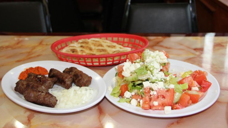 Cevapi (beef kababs) and the Shopska Salad at Cevabdzinica Sarajevo in Astoria.