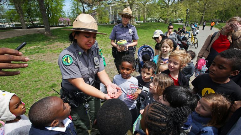 To celebrate the 40th anniversary of the Urban Park Rangers, Central Park Rangers Jess Tixi and Leanna Rodriguez teach a crowd of youngsters about bugs and their importance.