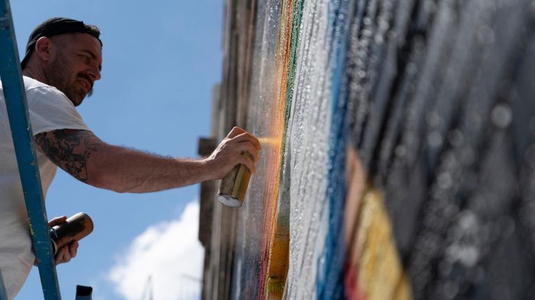 NYC Pride to unveil 50 street art murals with 'poignant messaging' 3 Irish street artist Solus paints a mural on Broome Street for The World Mural Project marking World Pride.