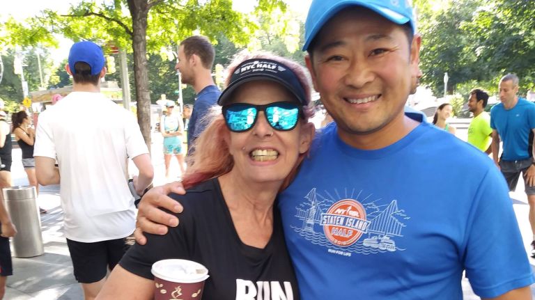 Rochelle Ann Rosa is pictured with Manson Wong, the physical therapist who aided her in her home for months to get her walking again after being paralyzed from an internal bleed.