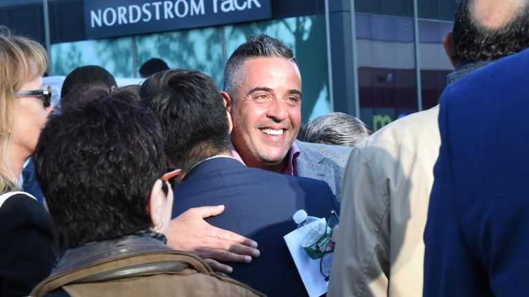 Opening of Empire Outlets heralded as changing the 'narrative of the 'forgotten borough' 3 Joe Ferrara of developer BFC Partners is congratulated at Wednesday's ribbon-cutting for the Empire Outlets in St. George, Staten Island.