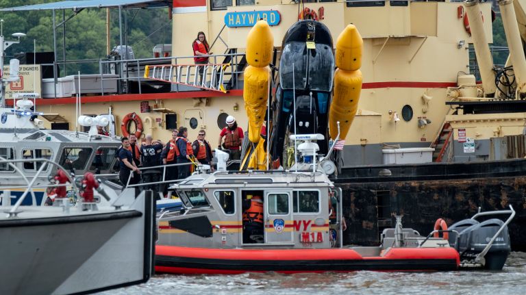 Helicopter crashes in Hudson River near 30th Street, FDNY says 2 A helicopter that crashed into the Hudson River at 30th Street on Wednesday is lifted from the water.
