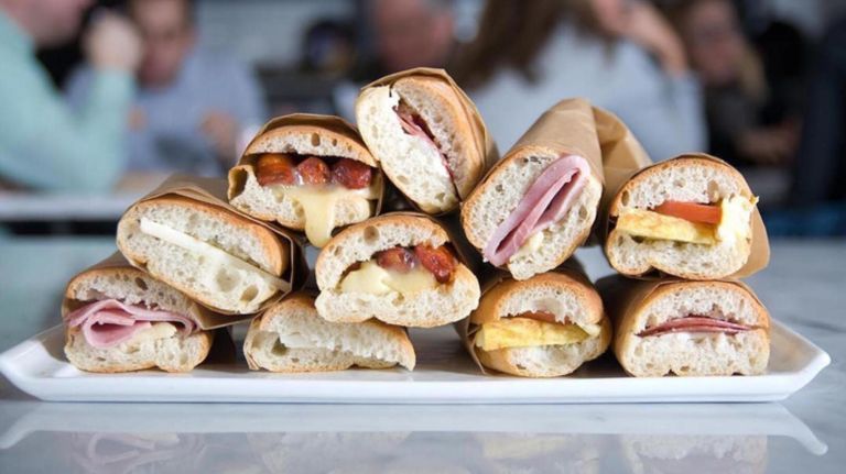 NYC markets update the classic food court with international flavors 7 Despaña Fine Foods & Tapas Café has a wide variety of bocadillos (sandwiches) for order.