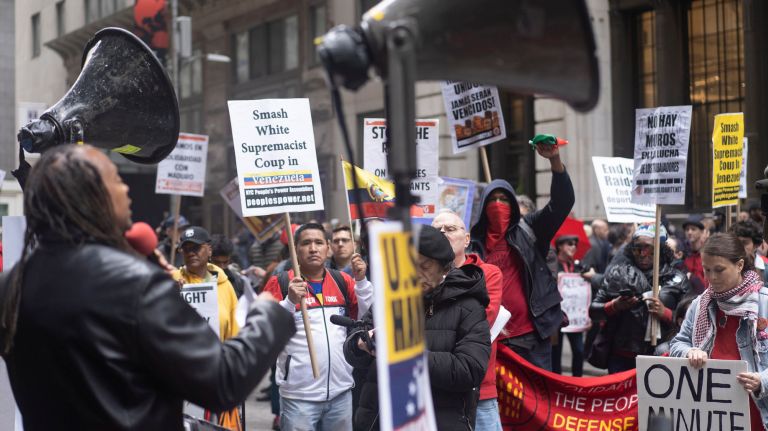 May Day protests throughout NYC defend workers' rights 2 Dozens of protesters rally outside the Trump Building on Wall Street for May Day on Wednesday.
