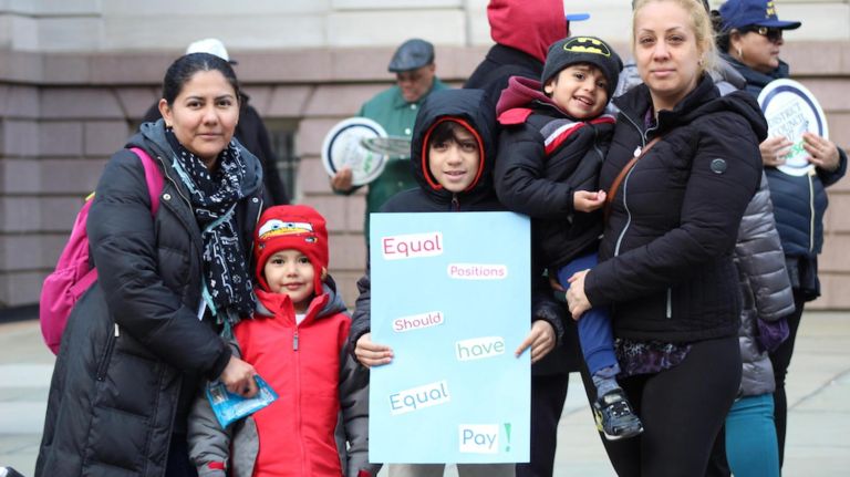 Advocates for salary parity rallied at City Hall on March 20.