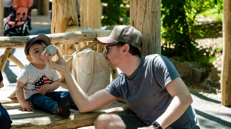 Being a stay-at-home dad is on-trend - and 'it's amazing' 6 Robert Payne helps his son Lachlan, 1, get in a quick bottle at the park.