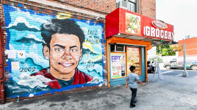 The mural outside of the bodega where Lesandro "Junior" Guzman-Feliz was attacked bears his birth and death dates:&nbsp;2002 and 2018.