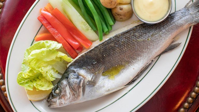 Celebrated restaurant Pastis returns to the Meatpacking District 5 A whole branzino, served with aioli and market vegetables, joins other seafood dishes including Trout Amandine and Skate Moutarde.