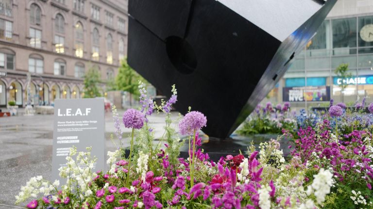 While you were sleeping, around 4 a.m. on June 11,&nbsp;the LMD team was installing flower bursts at the Astor Place Cube.