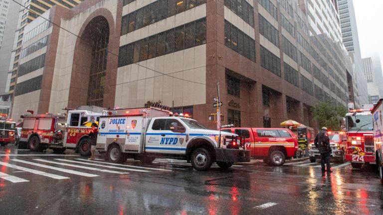 Police and firefighters descended 787 Seventh Ave., between 51st and 52nd streets in midtown, on Monday after a helicopter crash-landed on the roof of the building. 