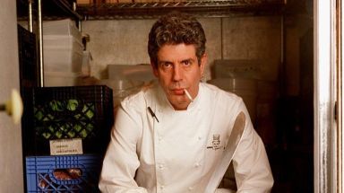 Anthony Bourdain poses inside the Park Avenue Les Halles refrigerator on May 19, 2000. 