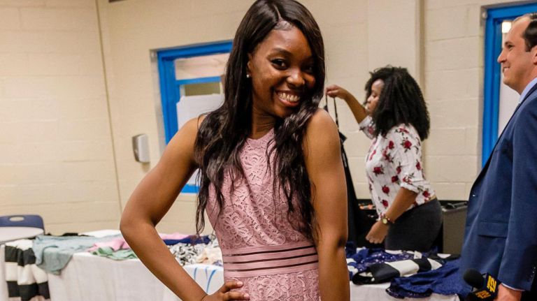 Iyana, 14, poses&nbsp;in the dress she chose during the Believe in Yourself dress giveaway in the Bronx on Tuesday.