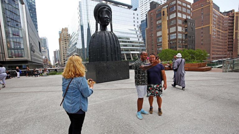 People look on at "Brick House."