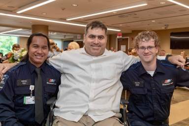 Sam Swartz with life-saving paramedics Sonny Hedge and Christopher Foote. (Courtesy Northwell Health)