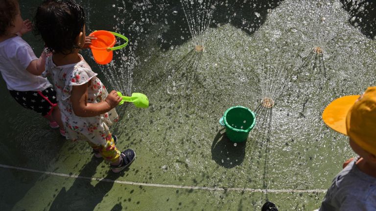 Kids cool off at the Chelsea Green.