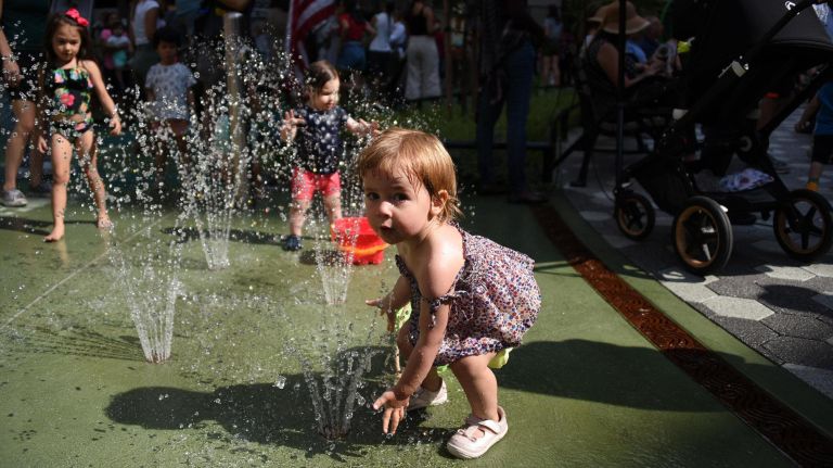 Diana Meyers, 2, of Chelsea, plays at the newly constructed Chelsea Green park.