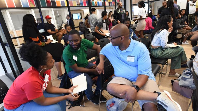 StartupBus participants met at the JPMorgan Chase Harlem branch Wednesday before boarding the bus for the five-day competition.