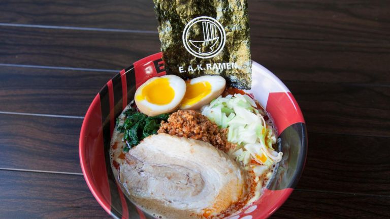 E.A.K. Ramen specializes in ramen creations, such as the pictured "Oh so hot!" ramen, with spinach, chashu, nori, bean sprouts, cabbage, spicy miso ground chicken, and thick noodles in pork and chicken broth.&nbsp;