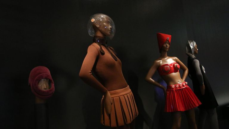 A bodystocking dress from 1968 is displayed at left, alongside a plastic and vinyl suit from 1968.&nbsp;