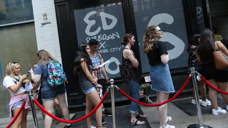 Fans wait in line to get into the Ed Sheeran pop-up shop in SoHo on Friday.