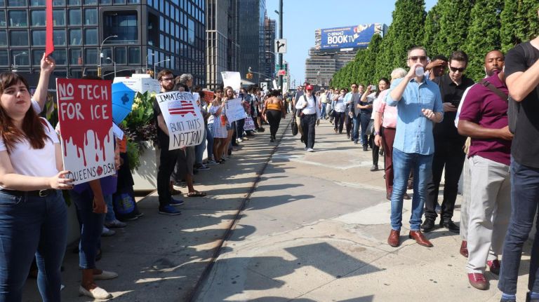 Hundreds protest Amazon summit to demand the tech giant cut ties with ICE 3 Protesters shouted at those waiting in line to enter the Amazon Web Services Summit.