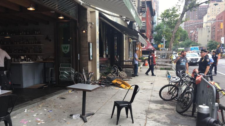 Taxi crashes into building in Manhattan, injuring 8, FDNY says 3 Part of a taxi cab was left on the sidewalk on Ninth Avenue in Hell's Kitchen after the driver slammed into a restaurant on Thursday, fire officials said.