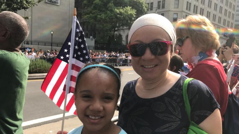 Griselia Polanco, 44, and her daughter Nour Soudani, 8, waited near the starting point of the Women's World Cup&nbsp;ticker-tape parade in lower Manhattan on Wednesday.