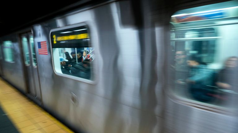 MTA overhaul must put public in front 2 People are seen though the window of an MTA subway 2 train as it pulls out of the Times Square subway station on Dec. 1, 2017.