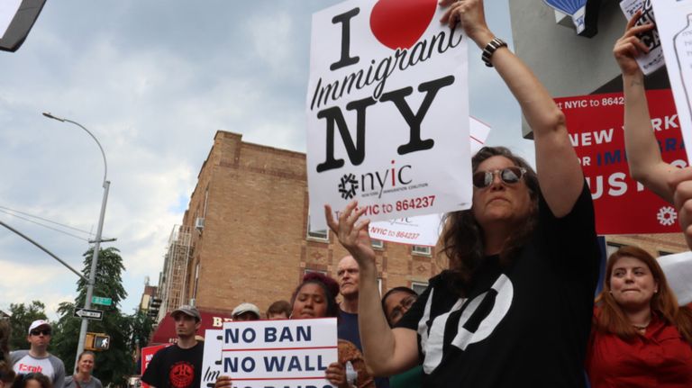 Protesters gather outside Rep. Max Rose's office in Bay Ridge.
