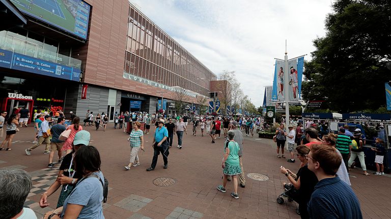 Fans roll into the Louis Armstrong Stadium at the Billie Jean King National Tennis Center last year.