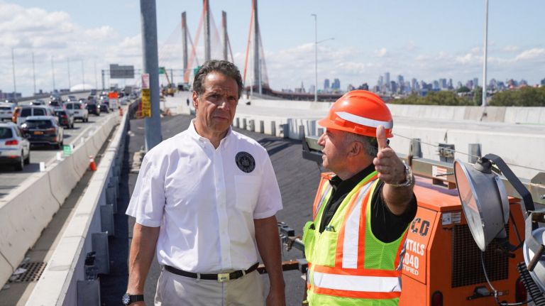 Gov. Andrew Cuomo meets with construction workers on the Kosciuszko Bridge on Sunday.