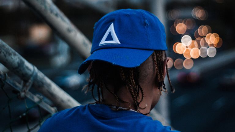 Tri&aacute;nguloswag items are now on sale at the Washington Heights Foot Locker.