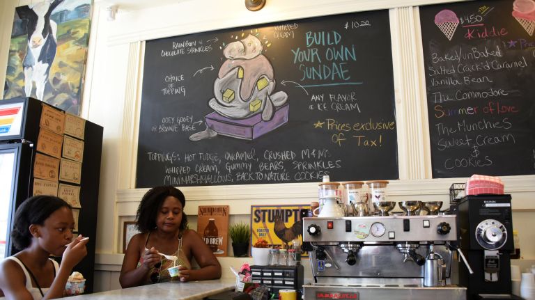Eden Nerestant, left, and mom Maggie Nerestant, of Brooklyn, cool off with ice cream at Ample Hills Creamery in Prospect Heights, Tuesday, August 20, 2019.