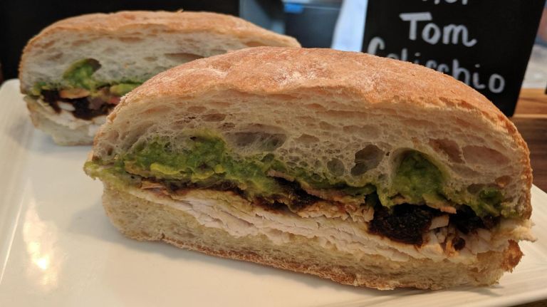 U.S. Open serves up celebrity chefs, Queens food vendors in Flushing Meadows 3 Celebrity chef Tom Colicchio's offerings for fans at his 'Wichcraft concessions include a roasted turkey and avocado sandwich. The item was on display during the U.S. Open Culinary Preview event at Aces restaurant on Thursday at Arthur Ashe Stadium in Flushing, Queens.