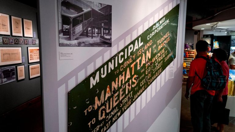New York Transit Museum exhibit explores 'competitive' signage history 3 An image in the exhibit shows a "Municipal Railway Corporation" sign, c. 1916, that was installed on the outside of a train station's staircase.